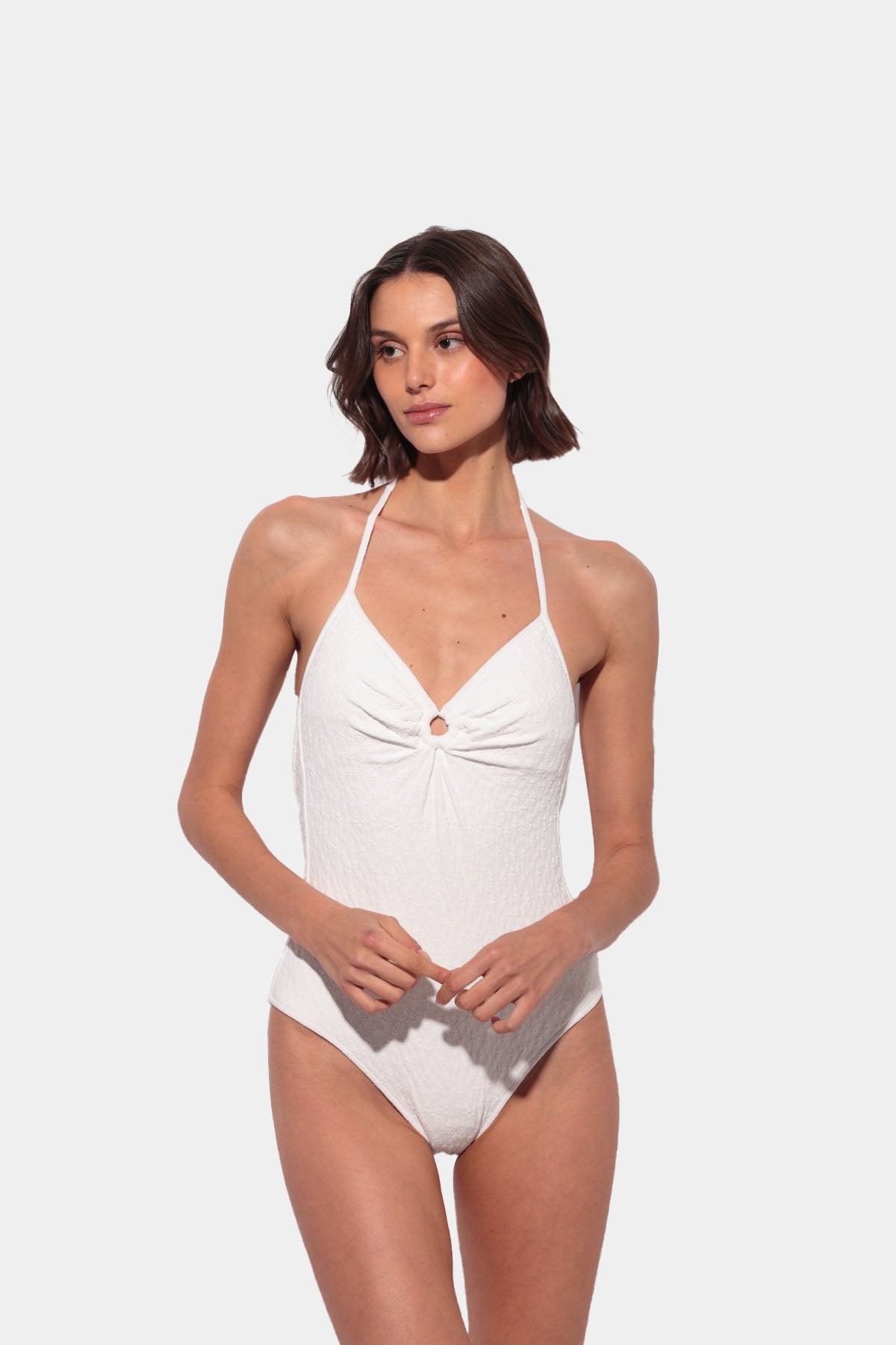 White swimsuit with a V-neck and low back